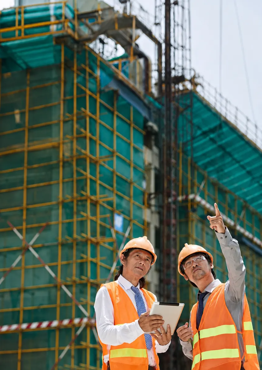 Engineers reviewing site plans together