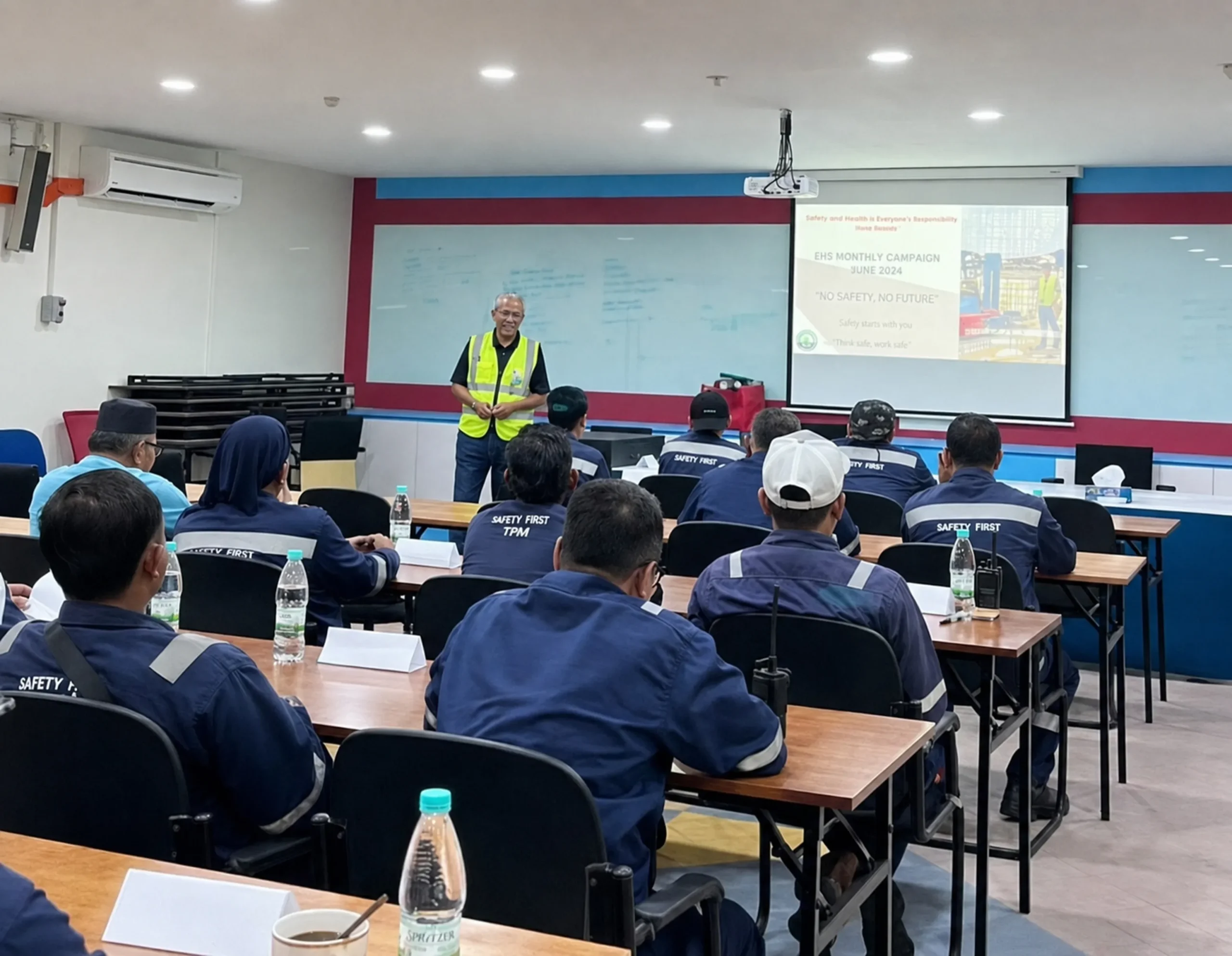 Workers attending a safety induction session