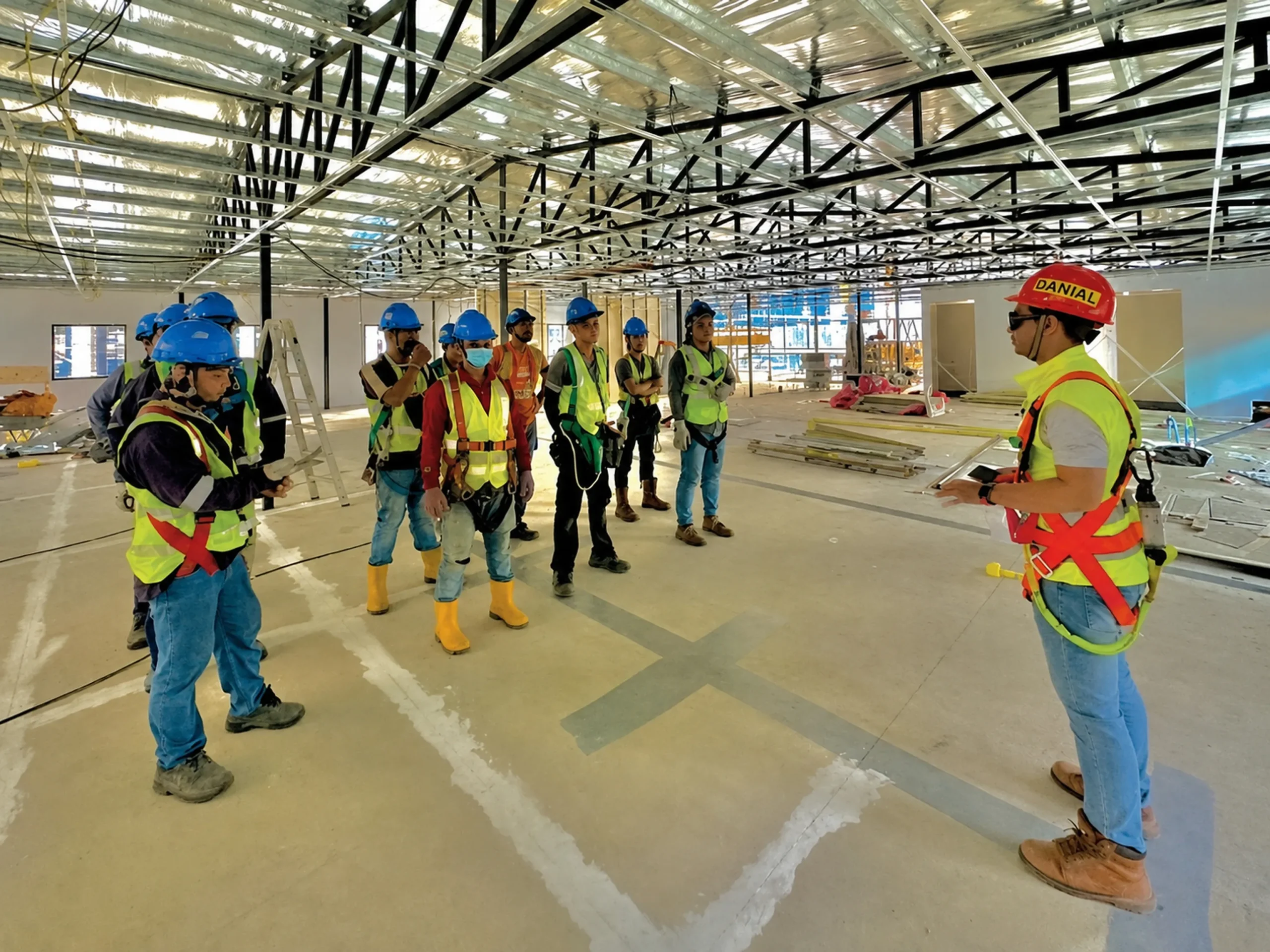 Trainer guiding workers through a site safety walkthrough