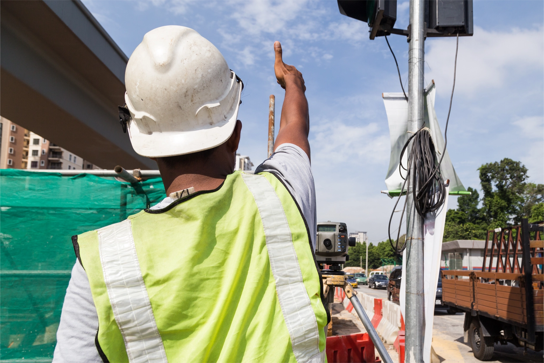 Traffic management officer directing vehicle movement at a road work zone